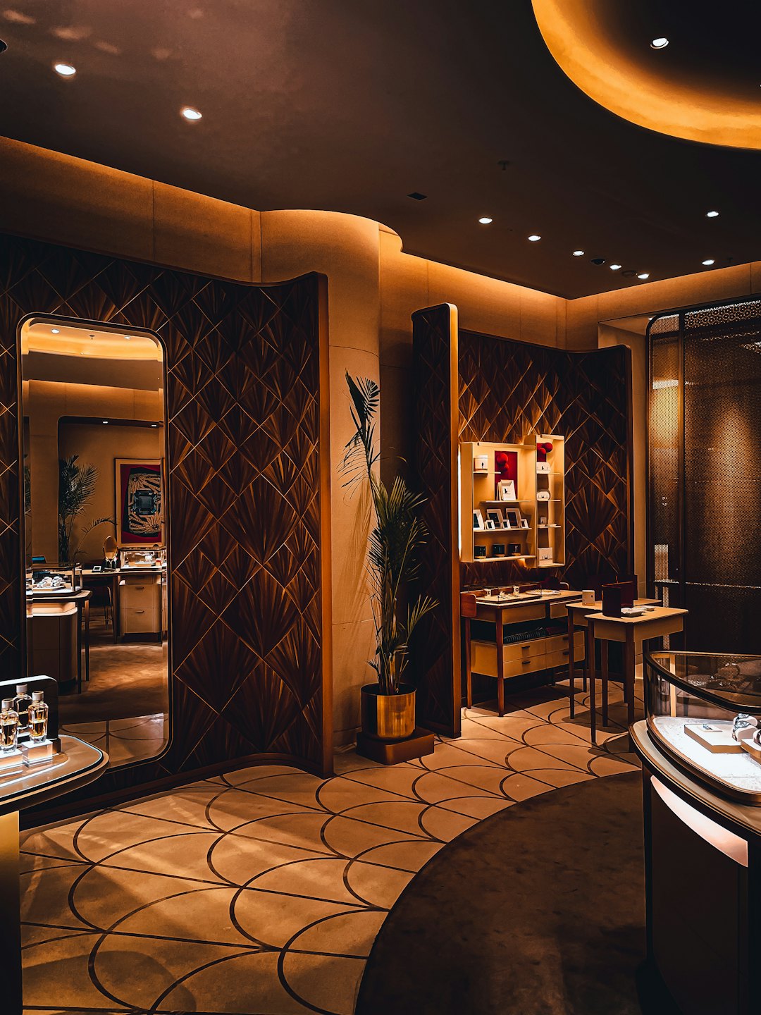 Elegant boutique interior featuring display cases and decorative wooden walls.